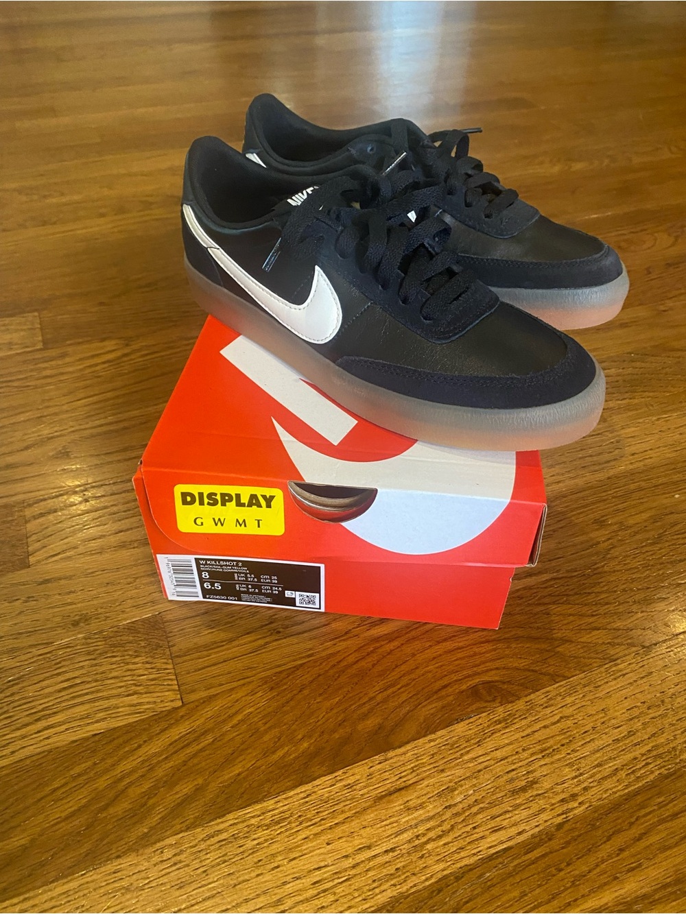 Nike Women’s Black Sneakers with White Swoosh